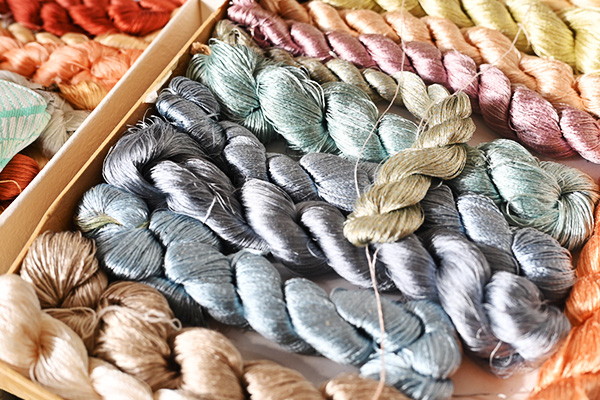 Colorful dyed silk threads arranged for Nishijin weaving