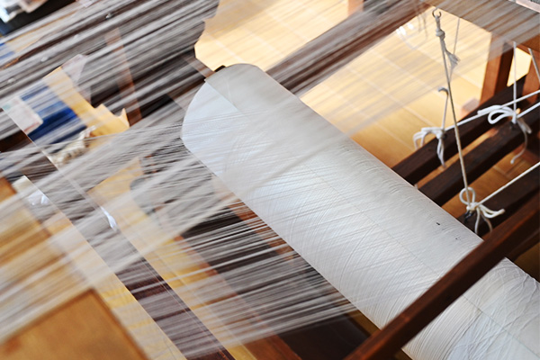 Warp threads set up on a traditional wooden loom