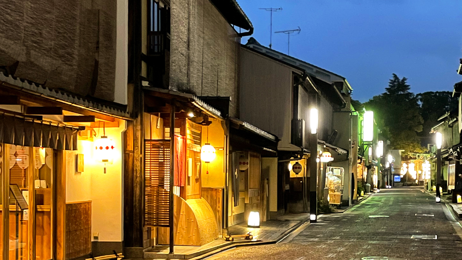 Atmospheric lantern-lit street in Kamishichiken at dusk
